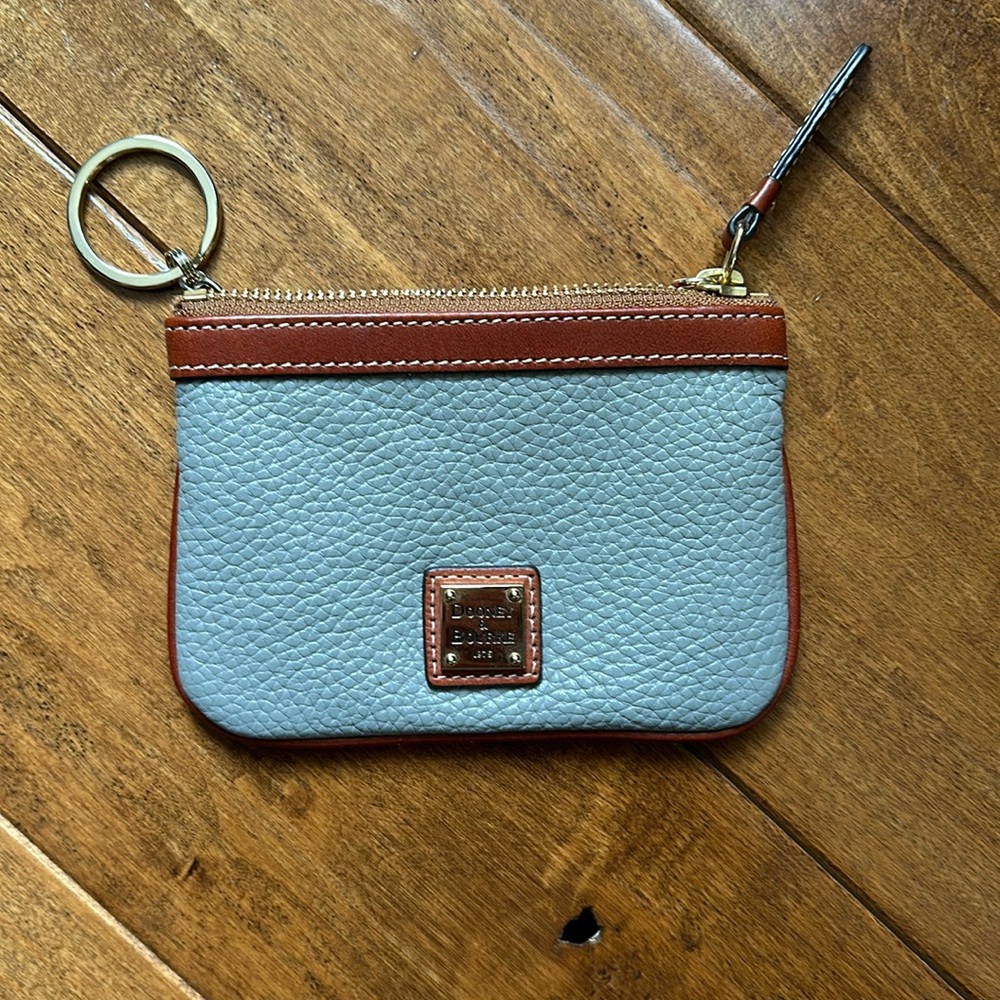 Dooney and Bourke grey coin purse with key ring.